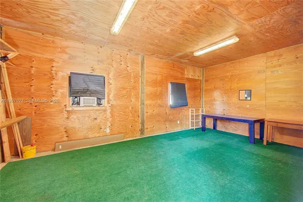 a bedroom with a bed and a table in it