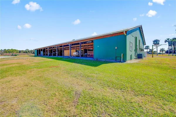 a living room with furniture and large window