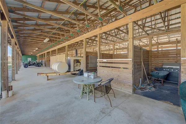 a view of a porch with a hanging chair