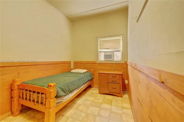 a view of a swimming pool with an outdoor seating and a yard