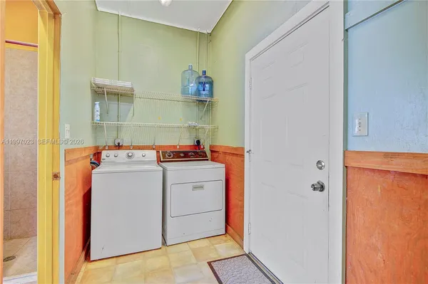 a view of a swimming pool with a table and chairs