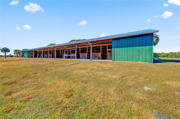 a view of a porch with wooden floor and windows