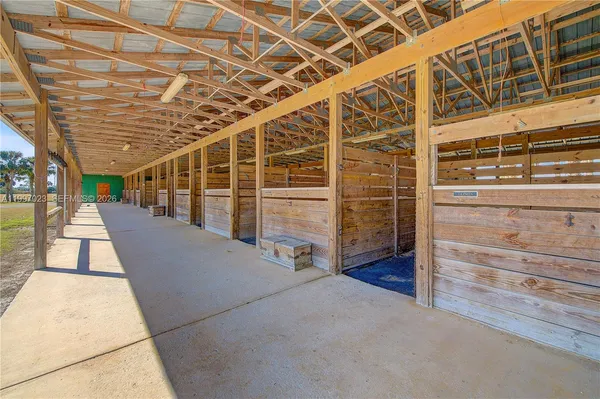 a view of a living room with furniture and a window