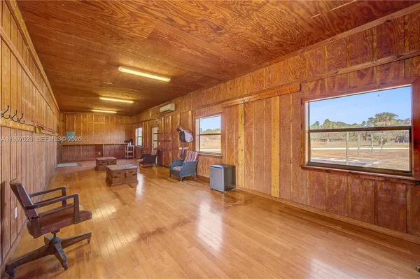 a spacious bathroom with a double vanity sink a mirror and a shower