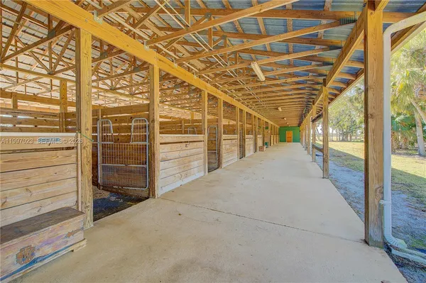 a living room with furniture and large windows
