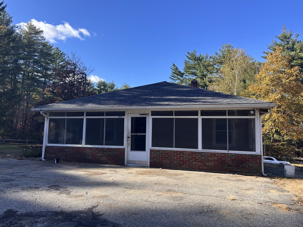 108 Mashapaug Road Sturbridge, MA 01566 - Photo 3 of 12 a front view of a house with a yard