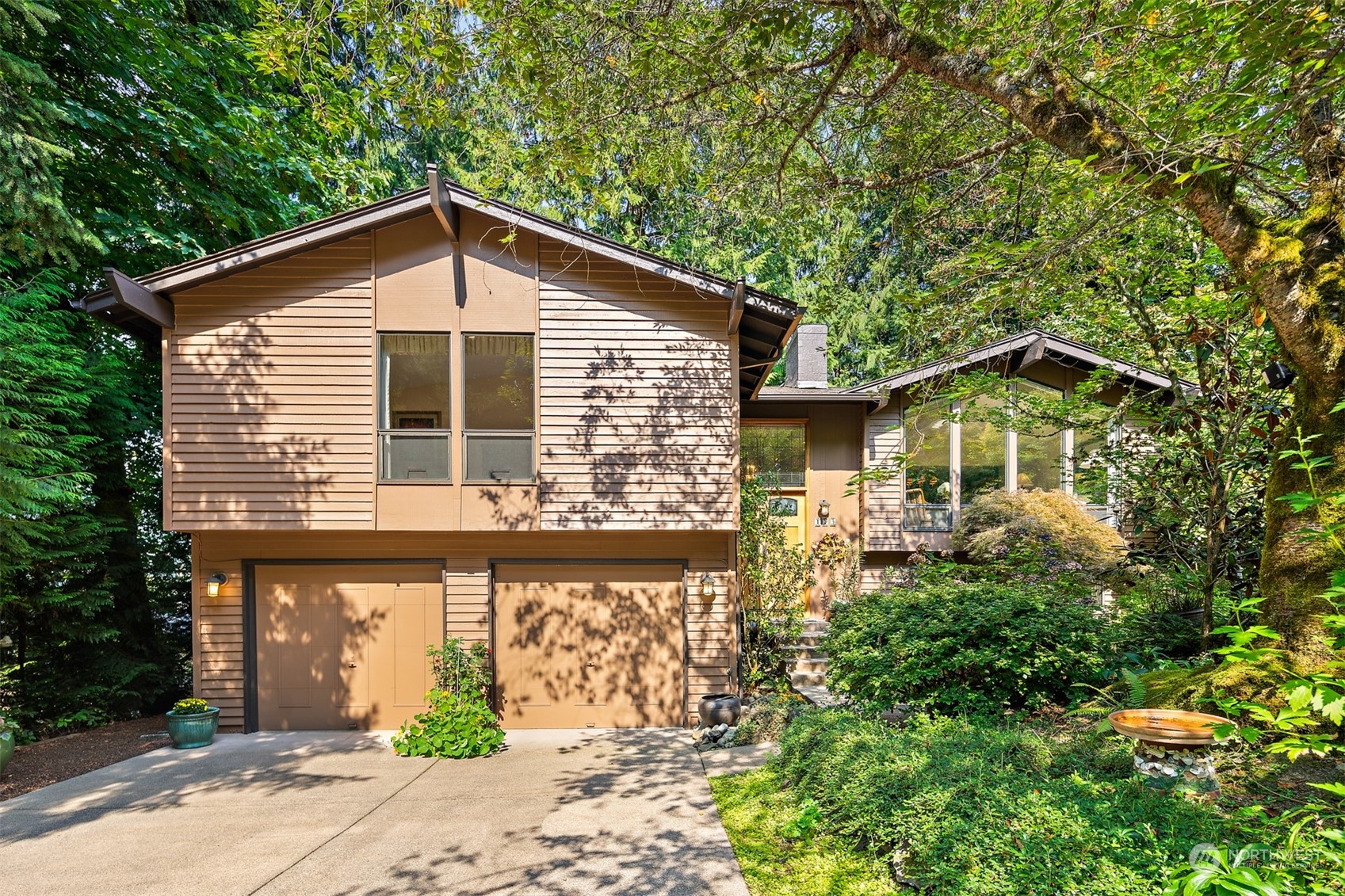 175 Mt Si Place Northwest Issaquah, WA 98027 - Photo 1 of 35 a front view of a house with a yard and potted plants