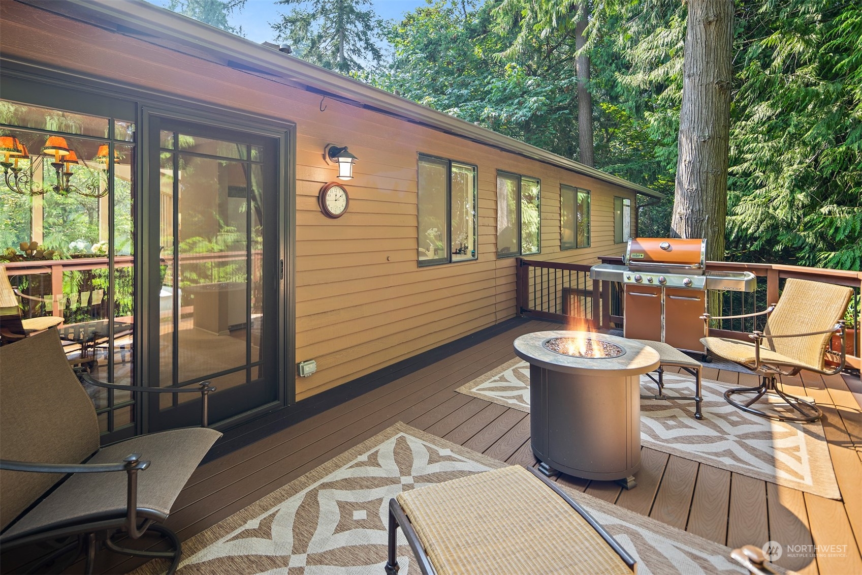 175 Mt Si Place Northwest Issaquah, WA 98027 - Photo 13 of 35 a view of a patio with table and chairs potted plants with wooden floor and fence