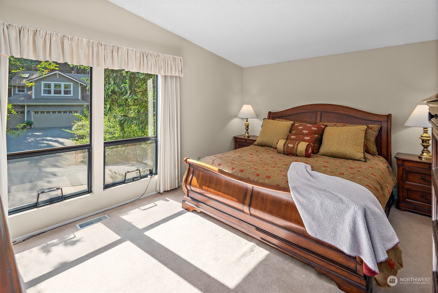 175 Mt Si Place Northwest Issaquah, WA 98027 - Photo 14 of 35 a spacious bedroom with a bed and a large window