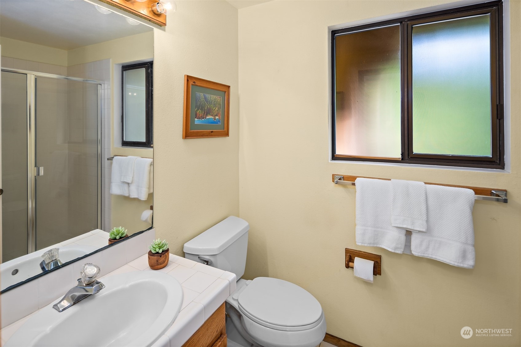 175 Mt Si Place Northwest Issaquah, WA 98027 - Photo 16 of 35 a bathroom with a sink and mirror with toilet