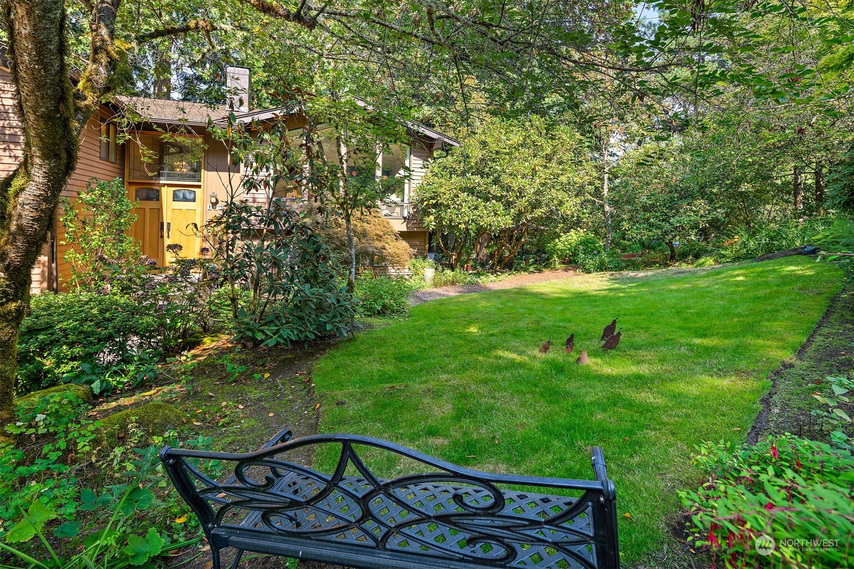 175 Mt Si Place Northwest Issaquah, WA 98027 - Photo 2 of 35 a view of a wooden fence and a bench