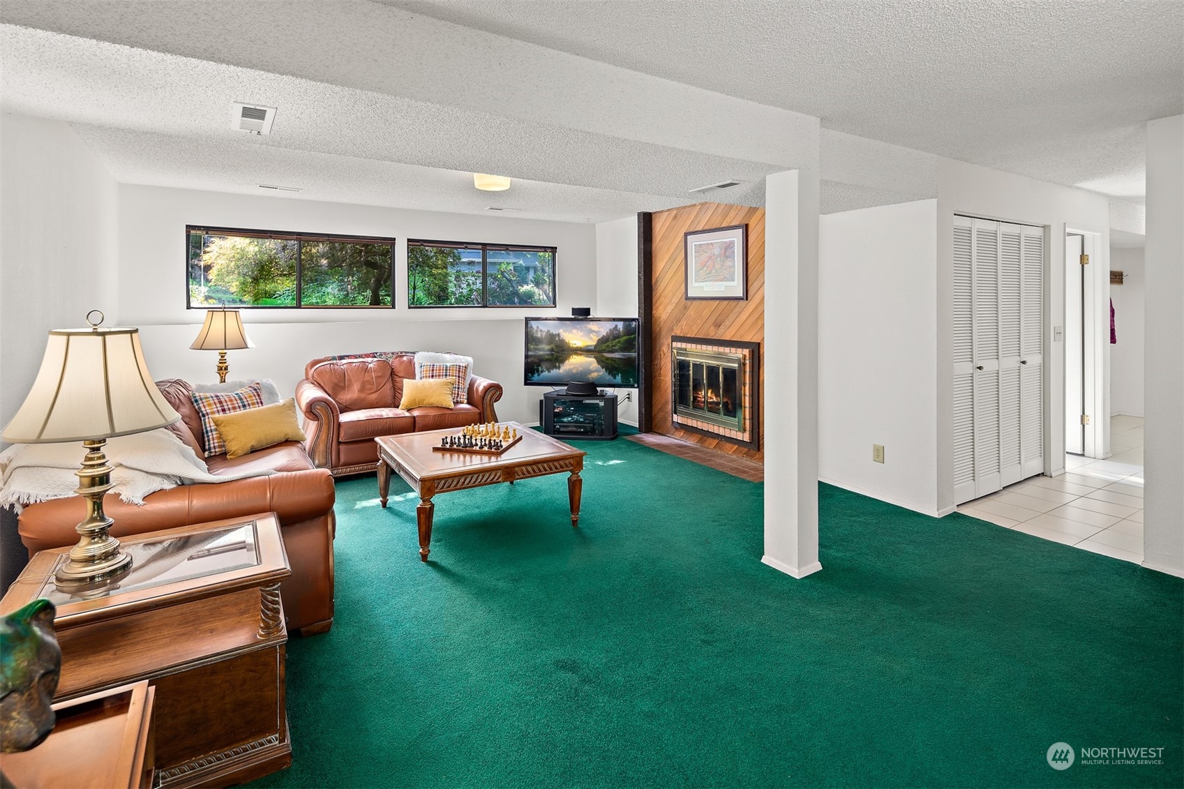 175 Mt Si Place Northwest Issaquah, WA 98027 - Photo 21 of 35 a living room with furniture and a fireplace