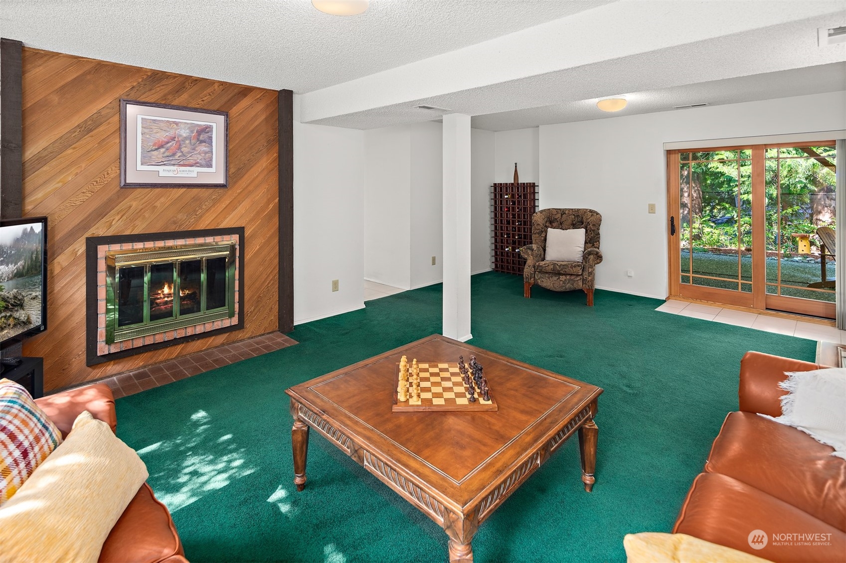 175 Mt Si Place Northwest Issaquah, WA 98027 - Photo 22 of 35 a living room with furniture a pool table and a fireplace