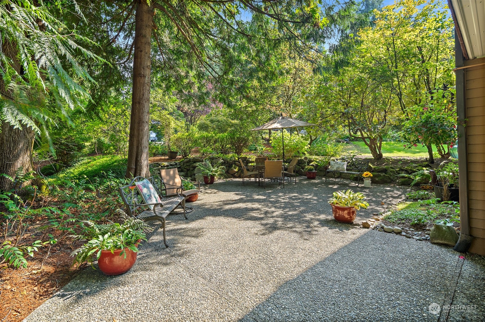 175 Mt Si Place Northwest Issaquah, WA 98027 - Photo 29 of 35 a backyard of a house with table and chairs