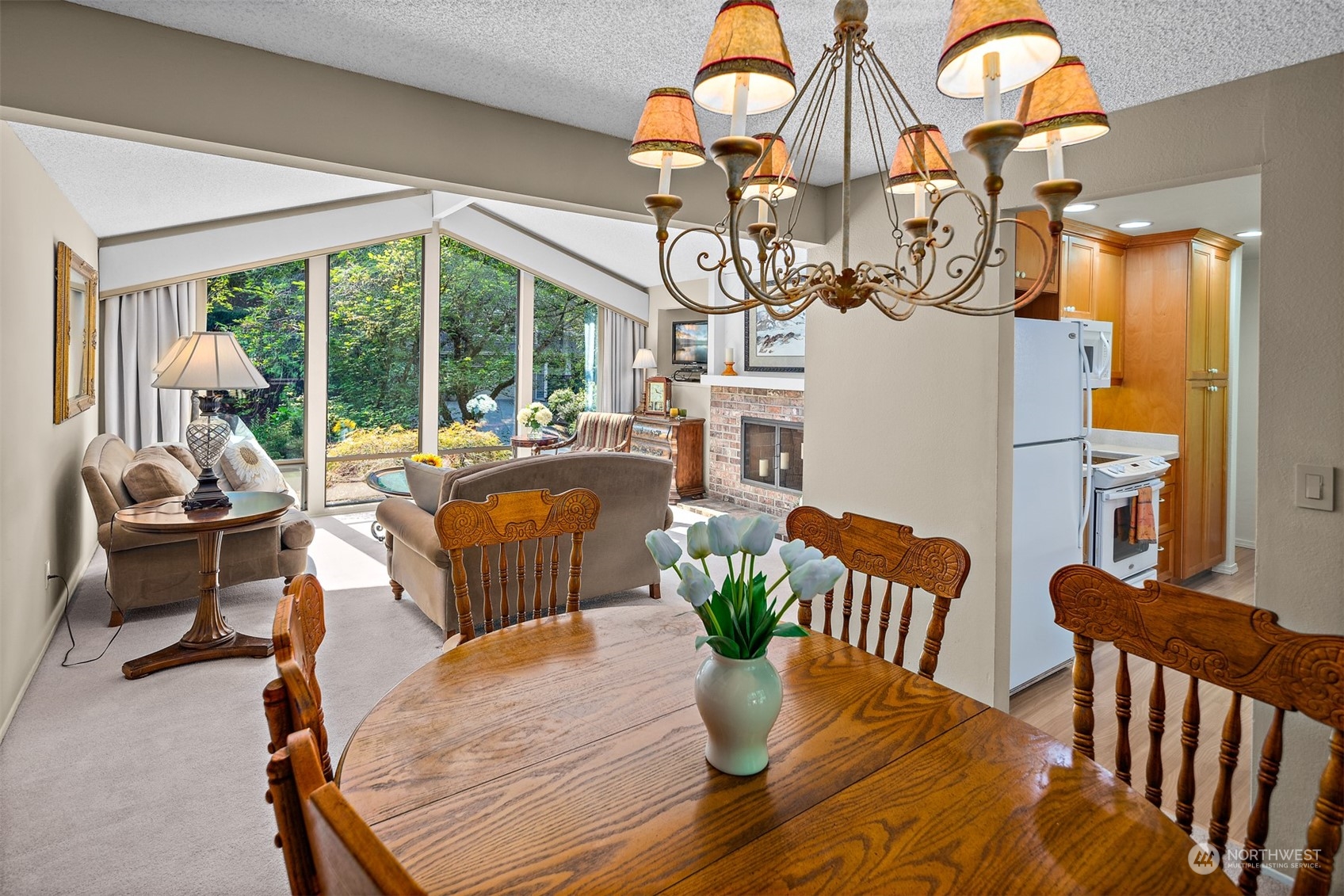 175 Mt Si Place Northwest Issaquah, WA 98027 - Photo 9 of 35 a dining room with furniture a chandelier and wooden floor