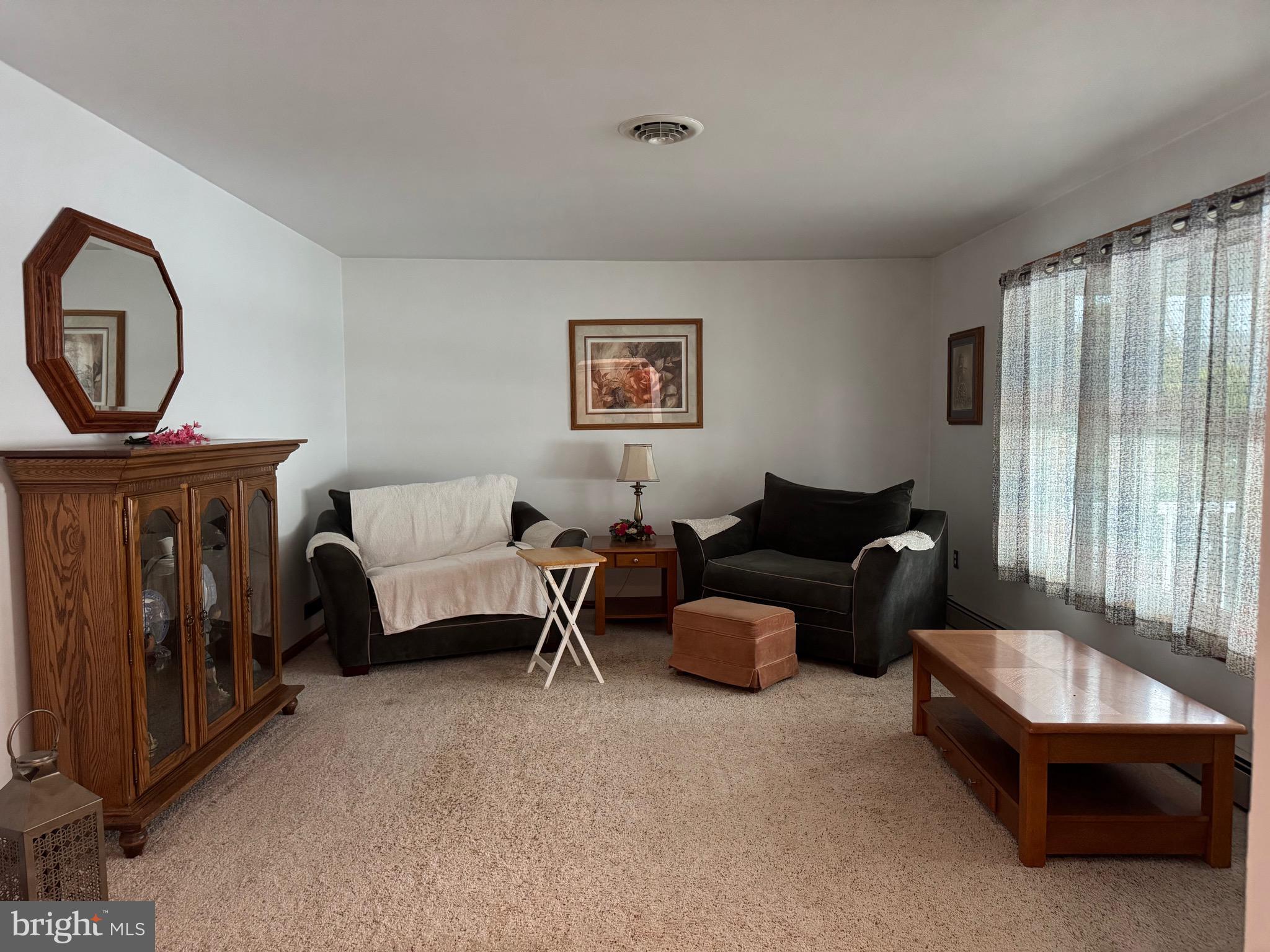 100 North Sandy Hill Road Coatesville, PA 19320 - Photo 19 of 21 a living room with furniture and a window