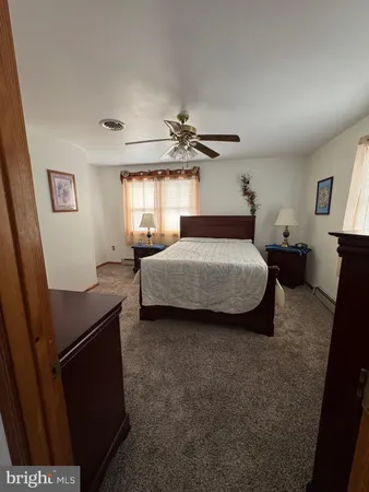 a bedroom with a bed and a table in it