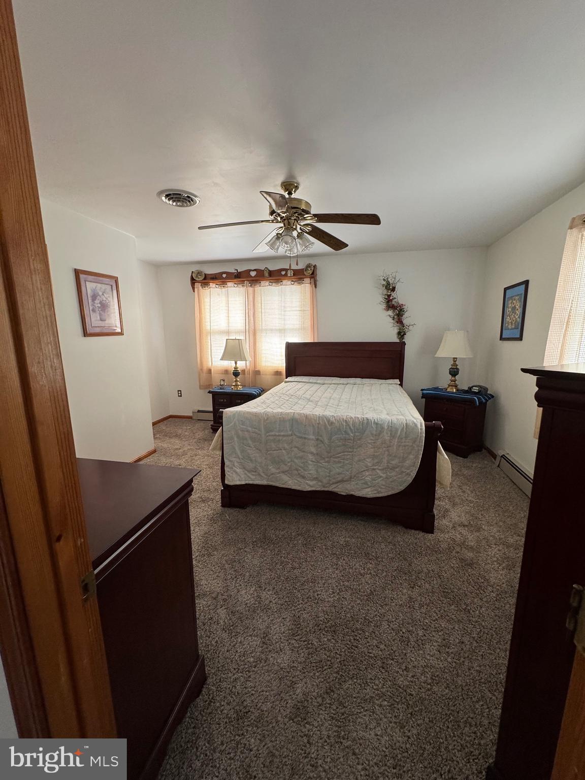 100 North Sandy Hill Road Coatesville, PA 19320 - Photo 3 of 21 a bedroom with a bed and a table in it