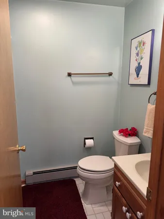 a bathroom with a toilet and a sink