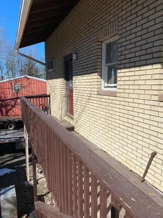 a view of balcony with wooden floor