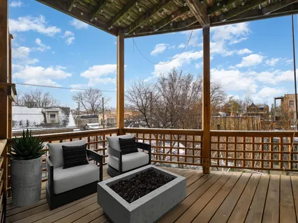 a view of a balcony with wooden floor