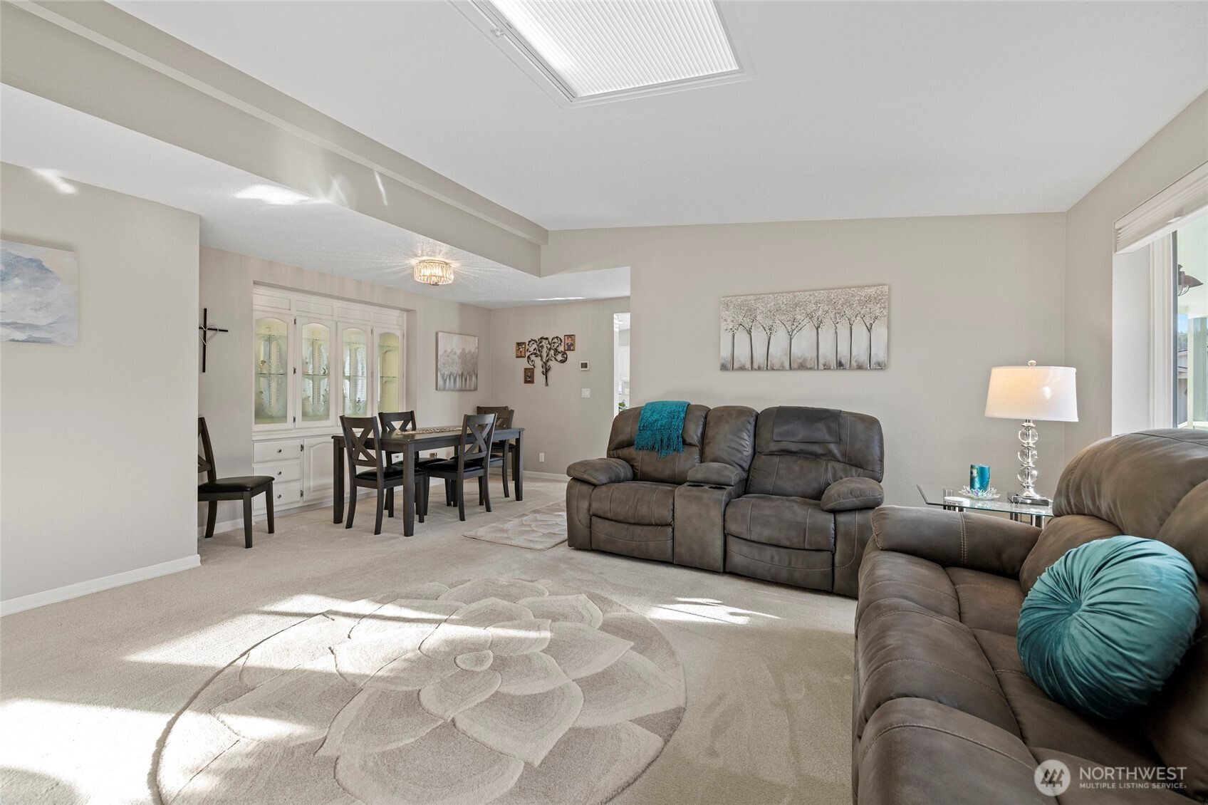 2610 East Section Street, Unit 12 Mount Vernon, WA 98274 - Photo 14 of 39 a living room with furniture and a dining table with kitchen view