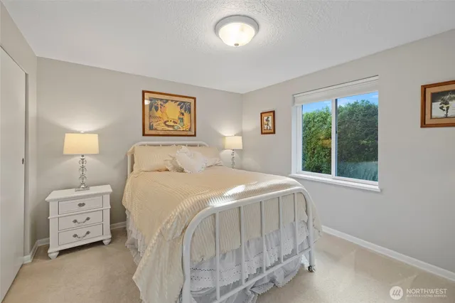 a bedroom with a bed and a tv