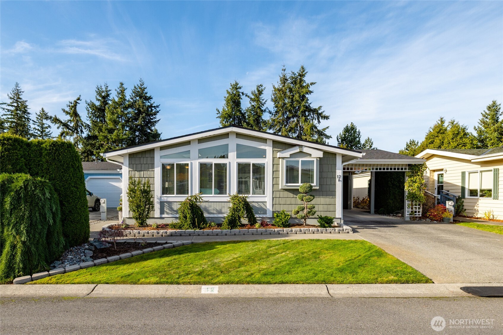 2610 East Section Street, Unit 12 Mount Vernon, WA 98274 - Photo 2 of 39 a front view of a house with porch