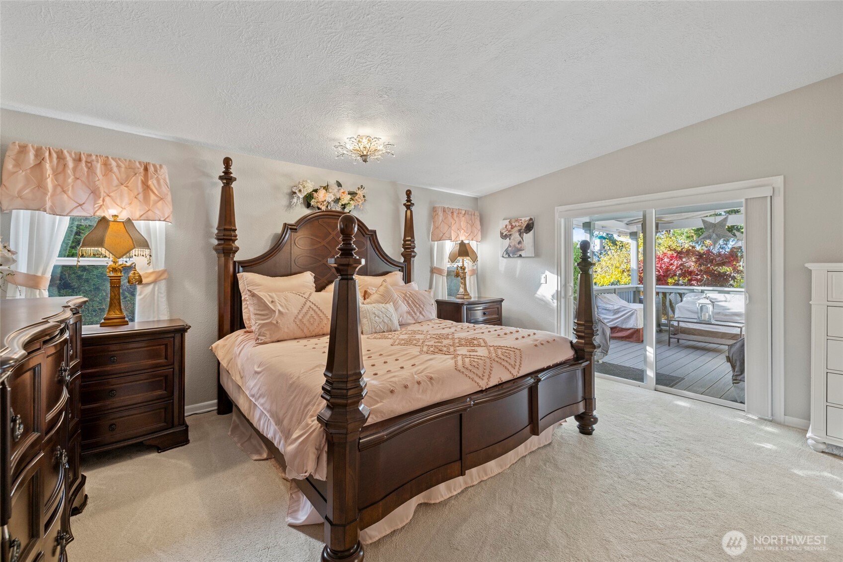 2610 East Section Street, Unit 12 Mount Vernon, WA 98274 - Photo 21 of 39 a bed room with a bed and a painting on the wall