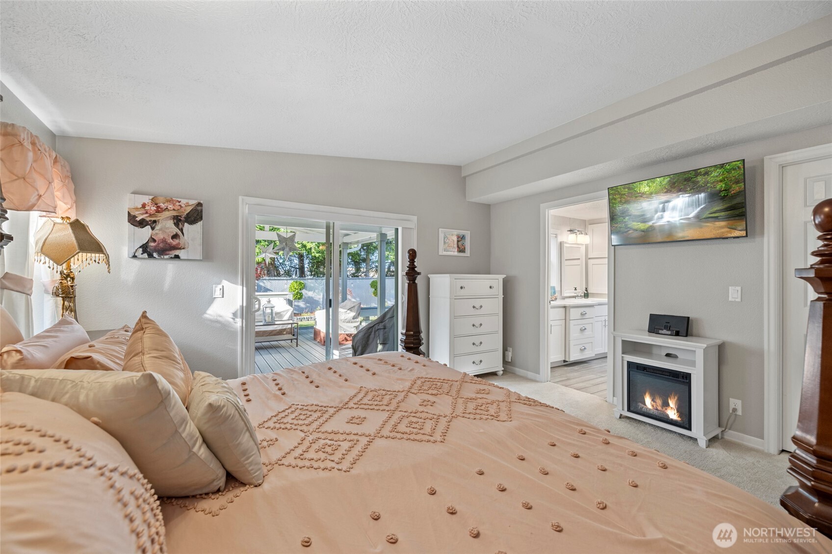 2610 East Section Street, Unit 12 Mount Vernon, WA 98274 - Photo 22 of 39 a bedroom with a bed and a fireplace