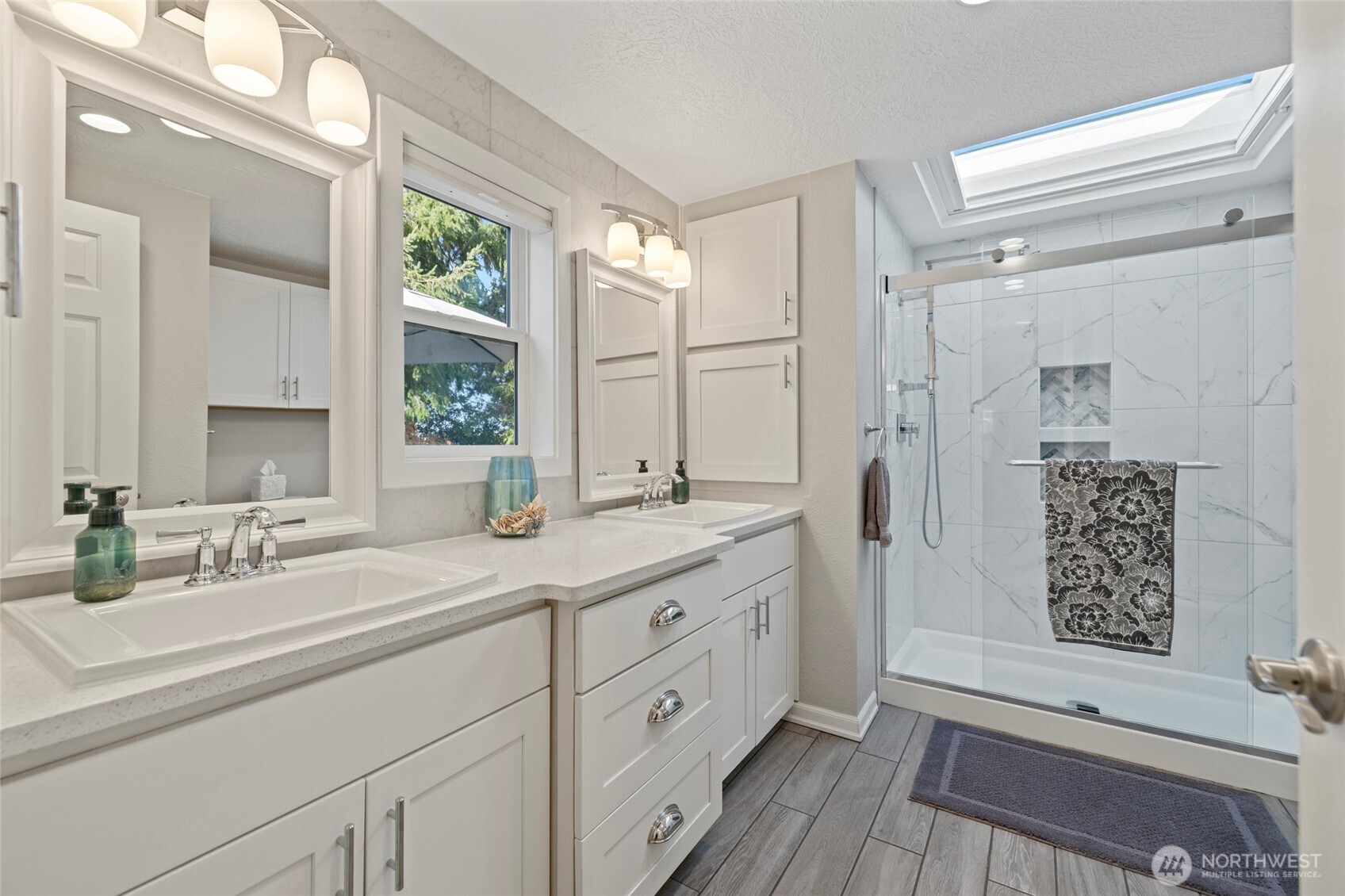 2610 East Section Street, Unit 12 Mount Vernon, WA 98274 - Photo 23 of 39 a spacious bathroom with double vanity a mirror and a shower