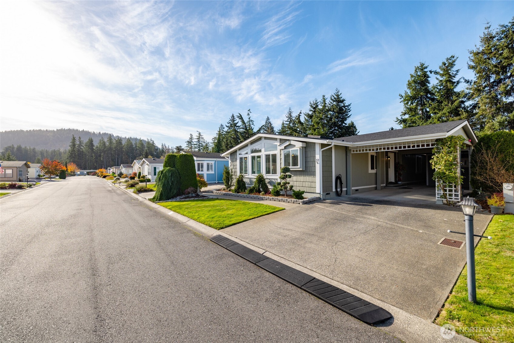 2610 East Section Street, Unit 12 Mount Vernon, WA 98274 - Photo 3 of 39 swimming pool view with a seating space and a garden view