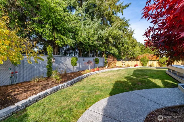 a patio with a patio table and chairs