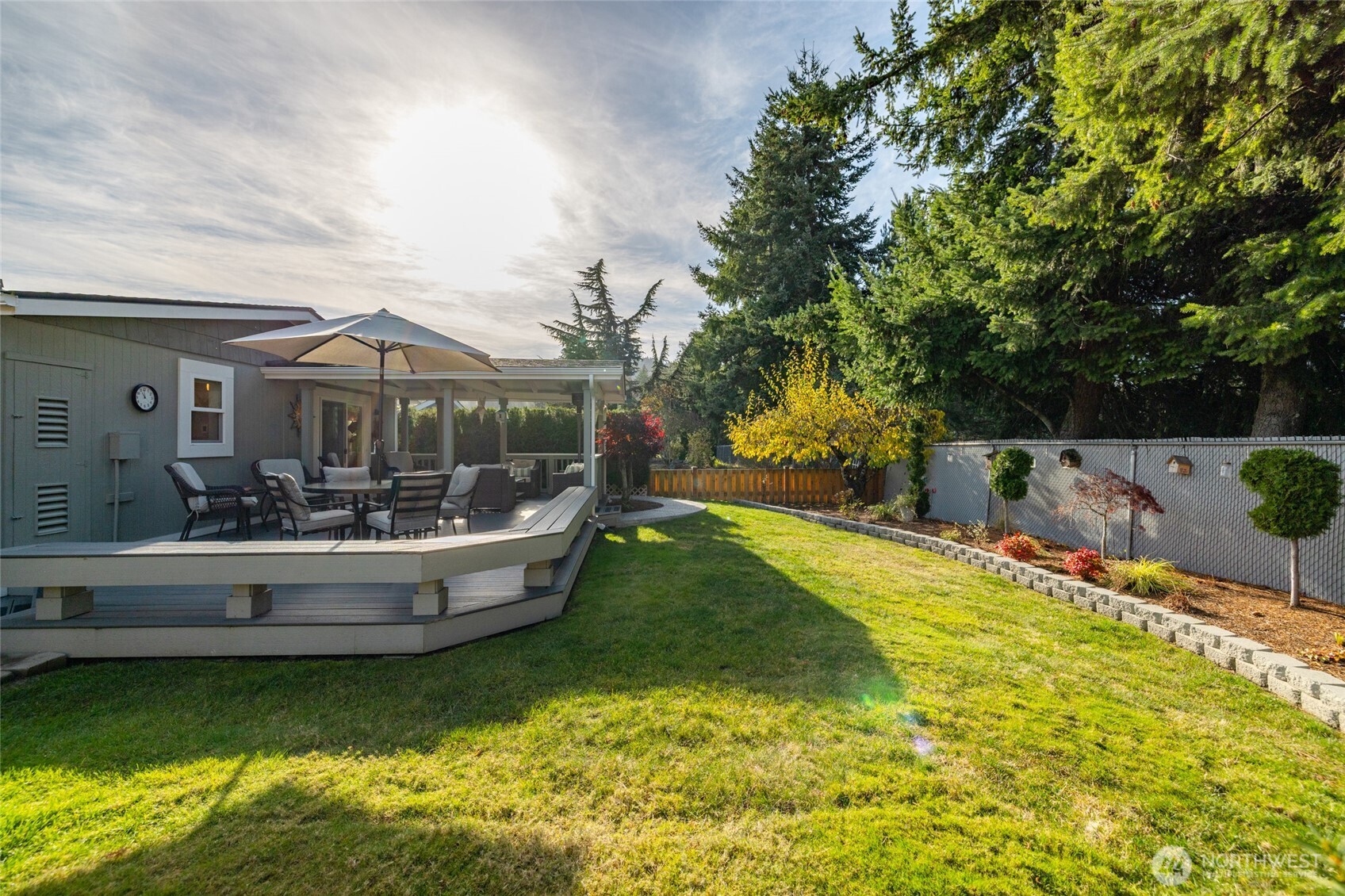 2610 East Section Street, Unit 12 Mount Vernon, WA 98274 - Photo 34 of 39 a view of a house with swimming pool and sitting area