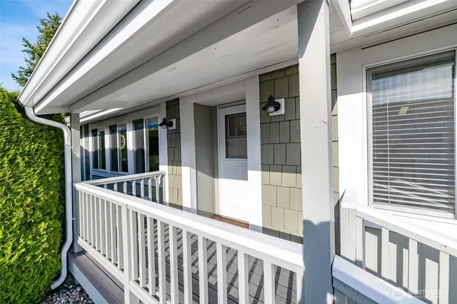 a view of staircase with small white fence