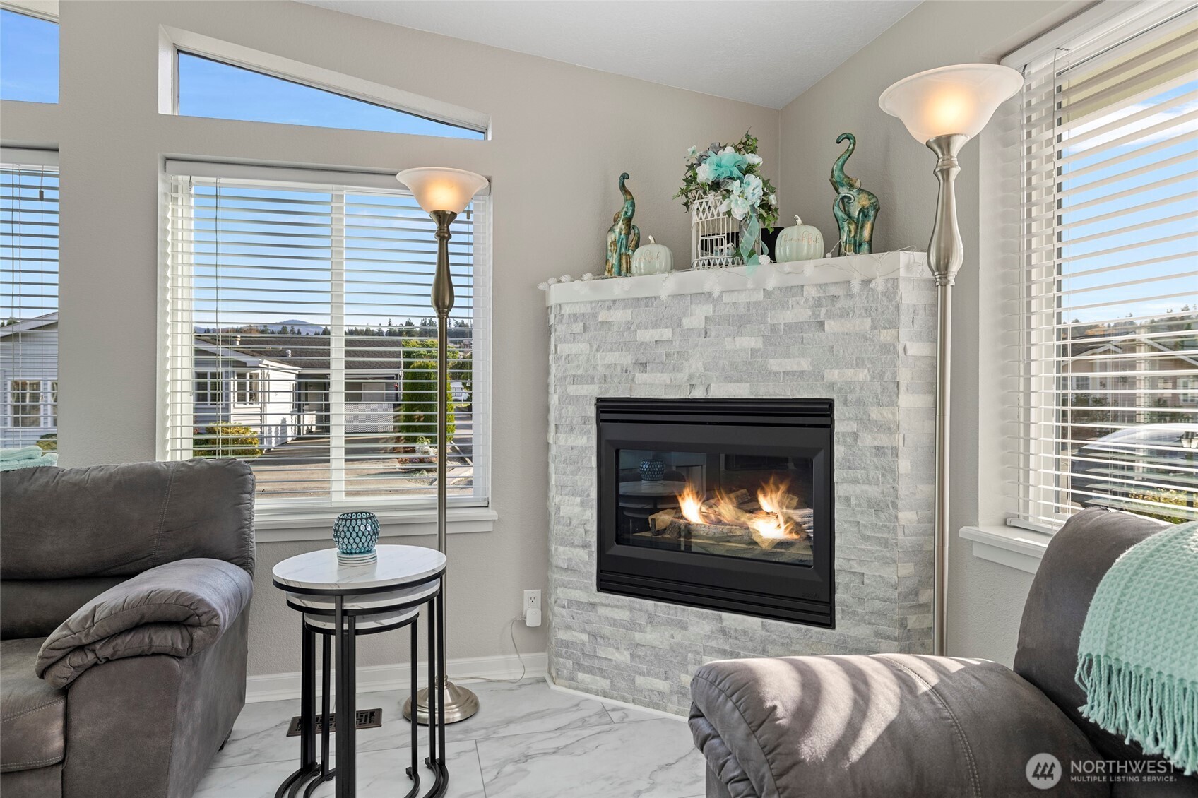 2610 East Section Street, Unit 12 Mount Vernon, WA 98274 - Photo 7 of 39 a living room with furniture and a fireplace