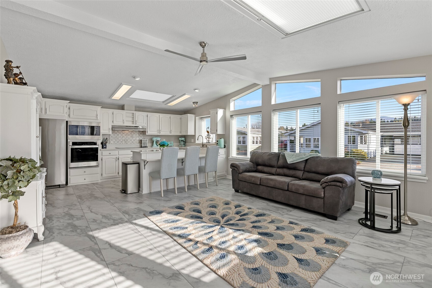 2610 East Section Street, Unit 12 Mount Vernon, WA 98274 - Photo 8 of 39 a living room with furniture and a fireplace