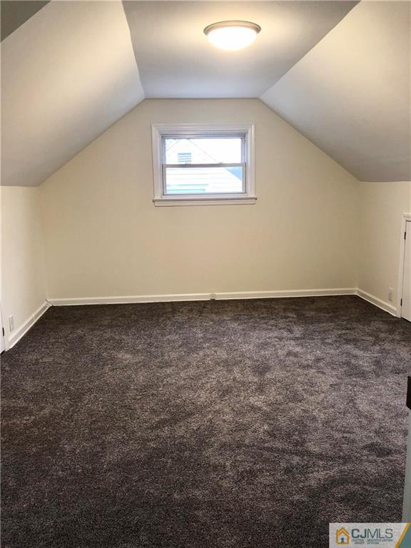 27 Forrest Street Iselin, NJ 08830 - Photo 11 of 12 an empty room with a chandeliers