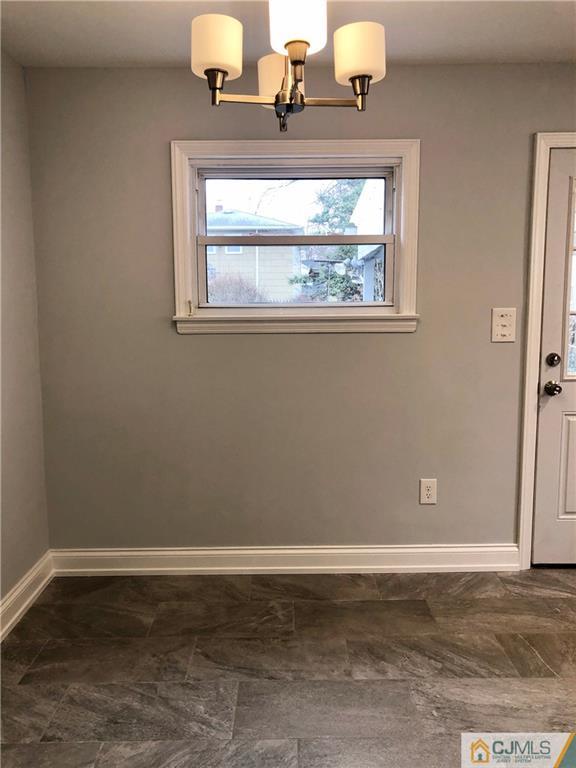 27 Forrest Street Iselin, NJ 08830 - Photo 6 of 12 a view of a livingroom with window