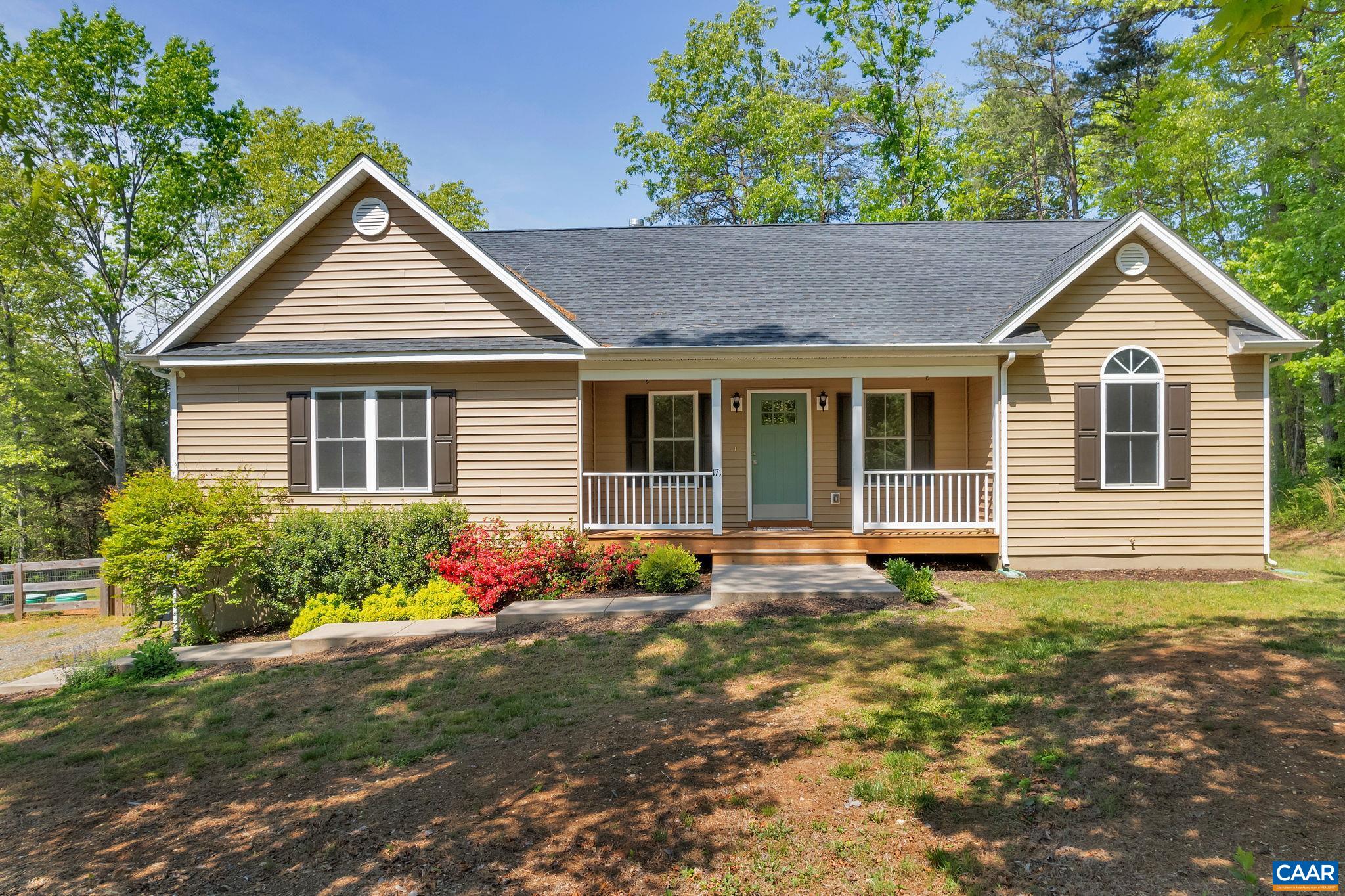 171 Goldenrod Road Ruckersville, VA 22968 - Photo 1 of 45 a house view with a garden space
