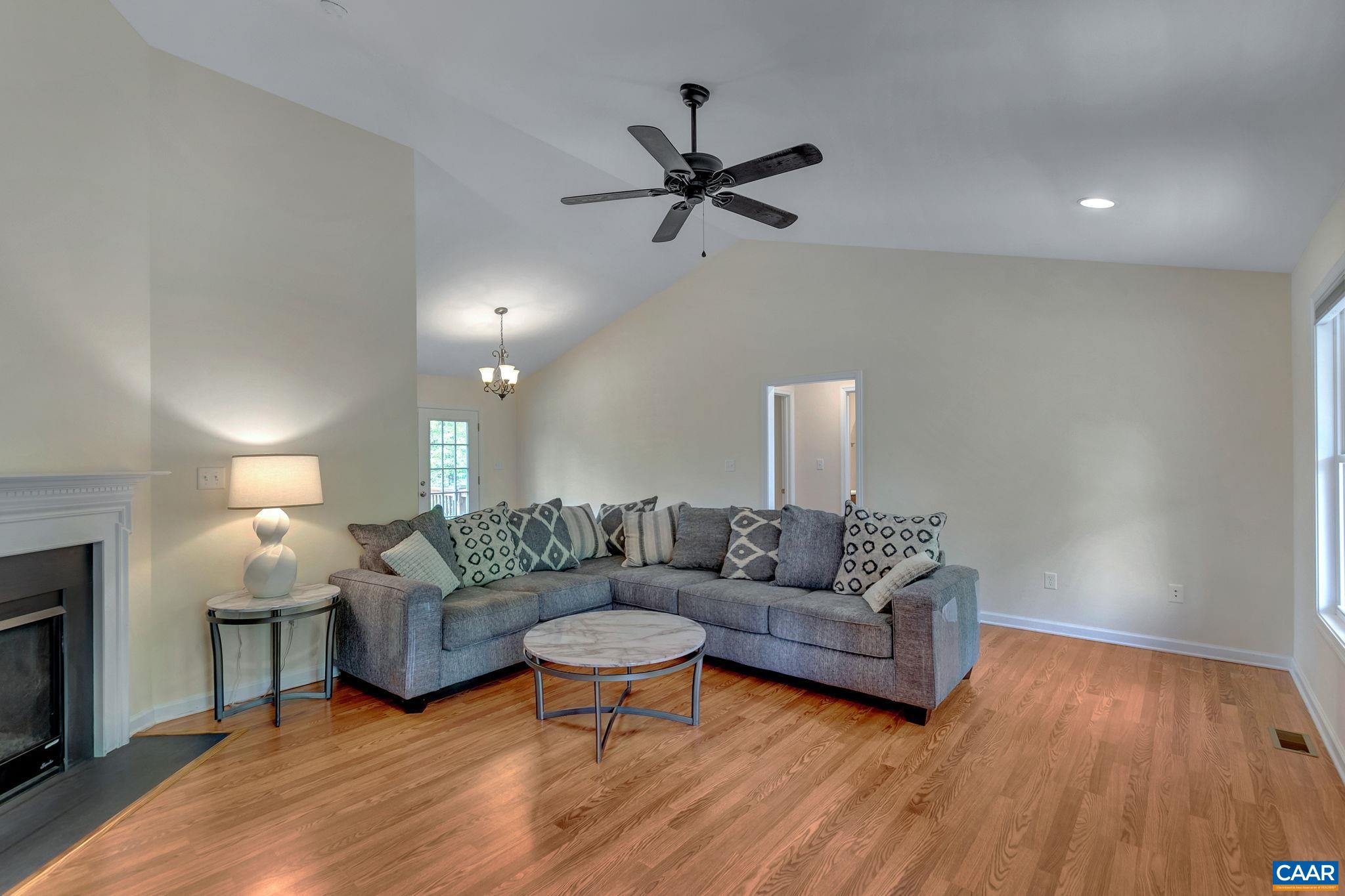 171 Goldenrod Road Ruckersville, VA 22968 - Photo 16 of 45 a living room with furniture and a wooden floor