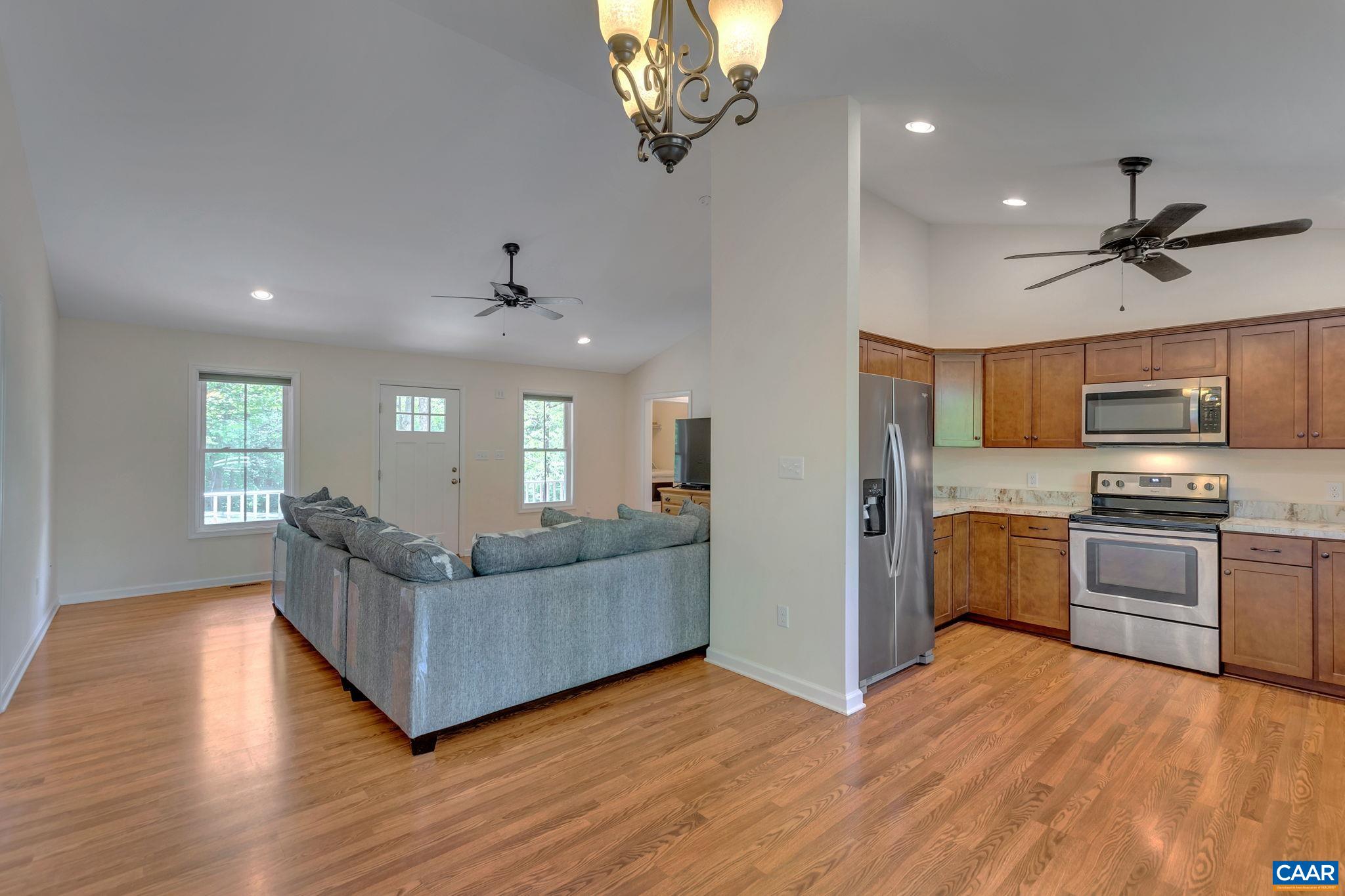 171 Goldenrod Road Ruckersville, VA 22968 - Photo 17 of 45 a living room with kitchen island furniture and a window