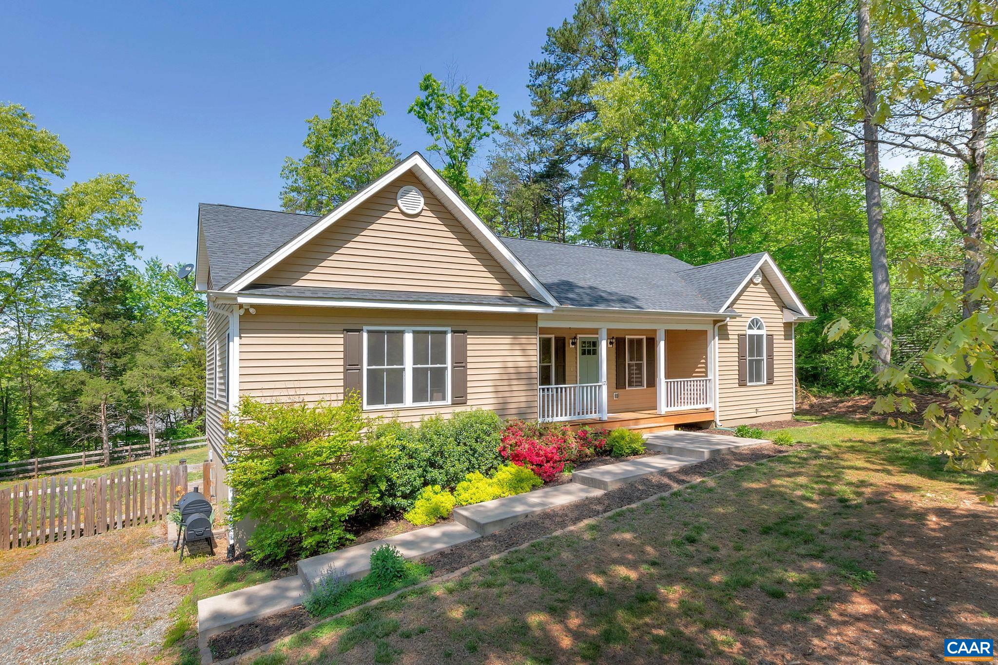 171 Goldenrod Road Ruckersville, VA 22968 - Photo 2 of 45 a front view of a house with a yard and potted plants