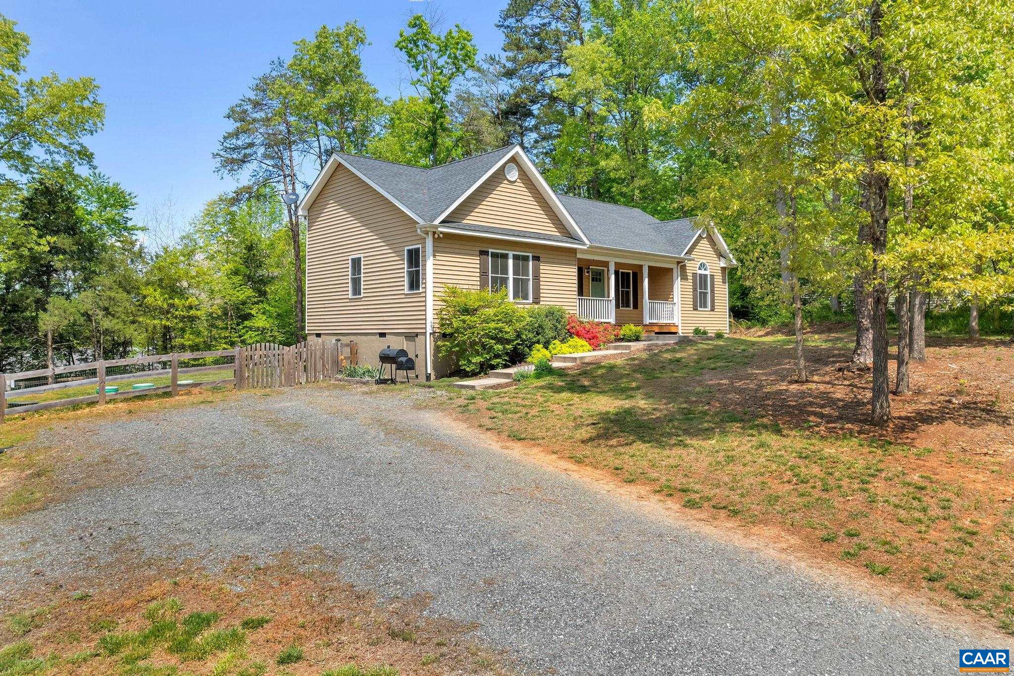 171 Goldenrod Road Ruckersville, VA 22968 - Photo 6 of 45 a view of a house with a yard and large trees