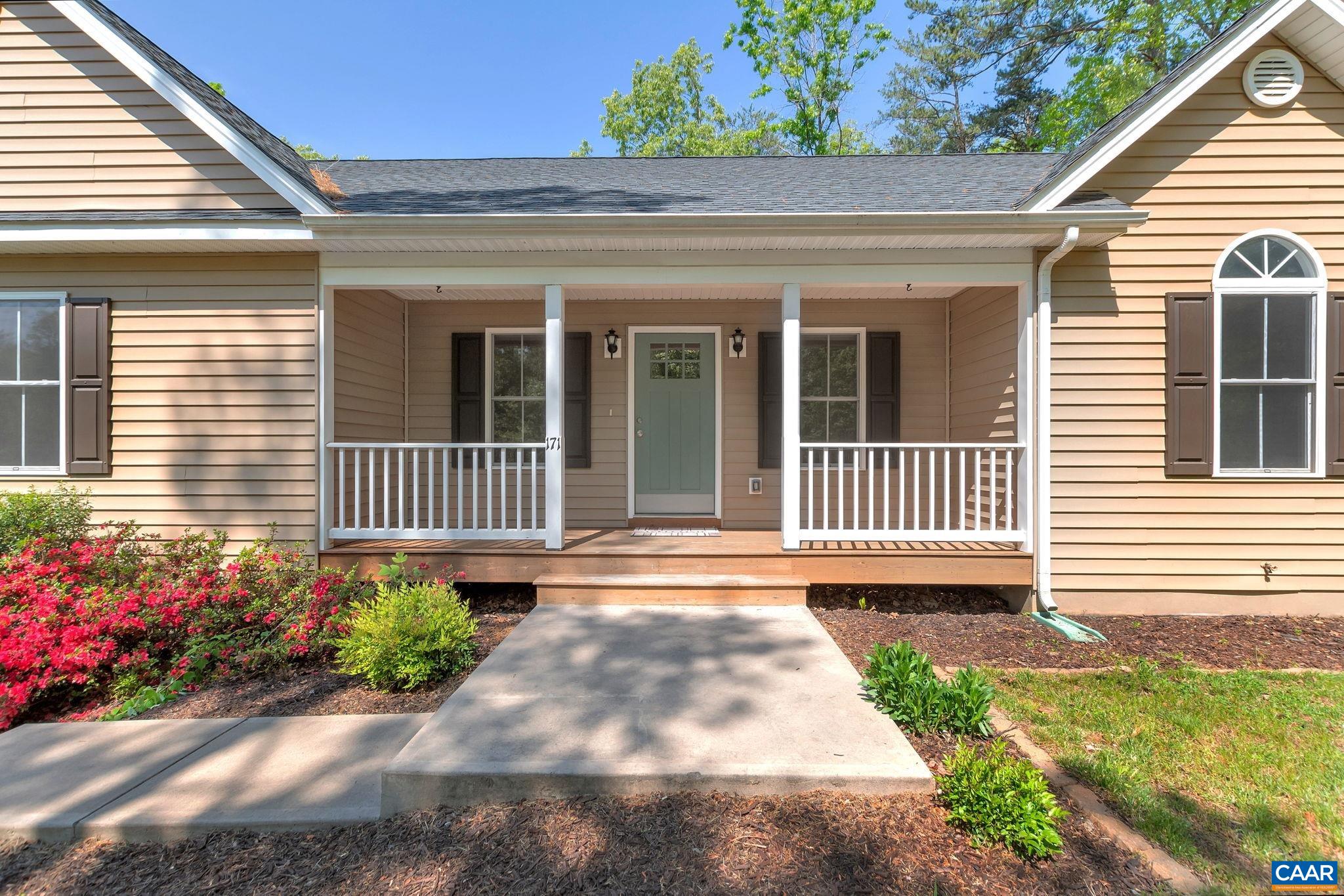 171 Goldenrod Road Ruckersville, VA 22968 - Photo 8 of 45 a front view of a house with a garden