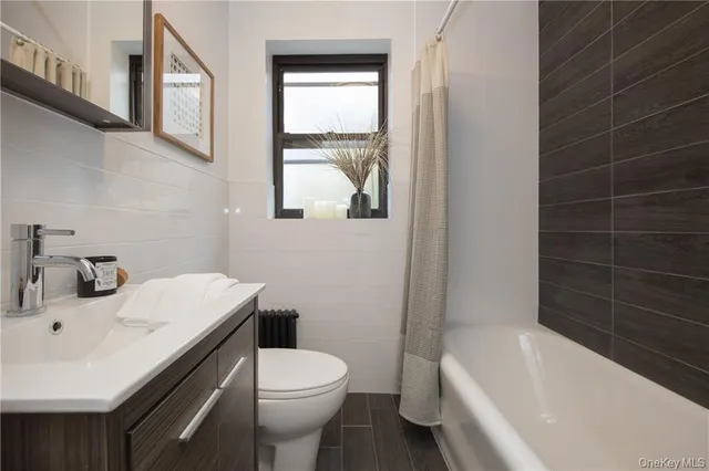 a bathroom with a sink toilet and bathtub