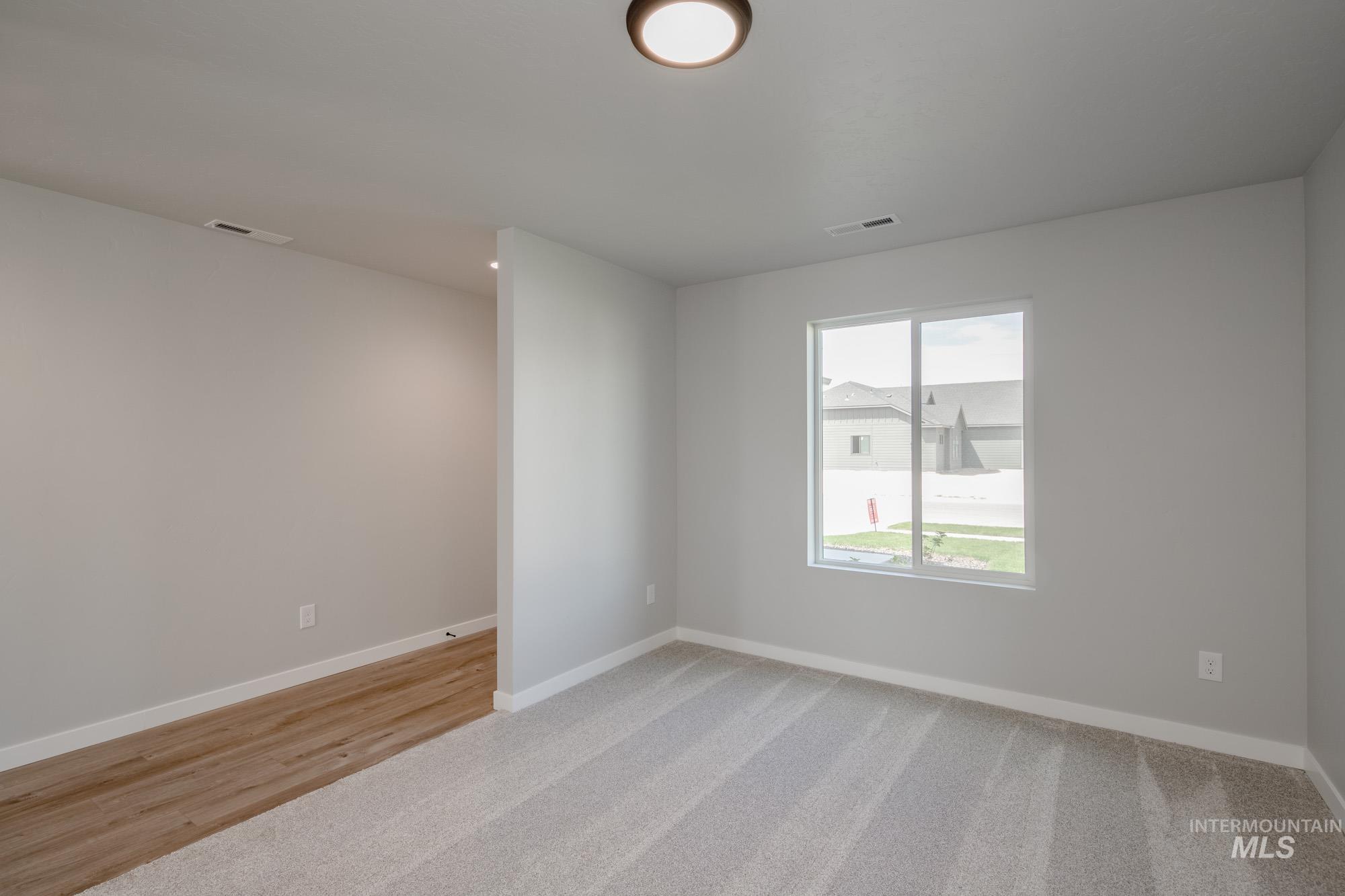 5328 Castleton Avenue Nampa, ID 83686 - Photo 15 of 26 Unfurnished room with baseboards and light colored carpet