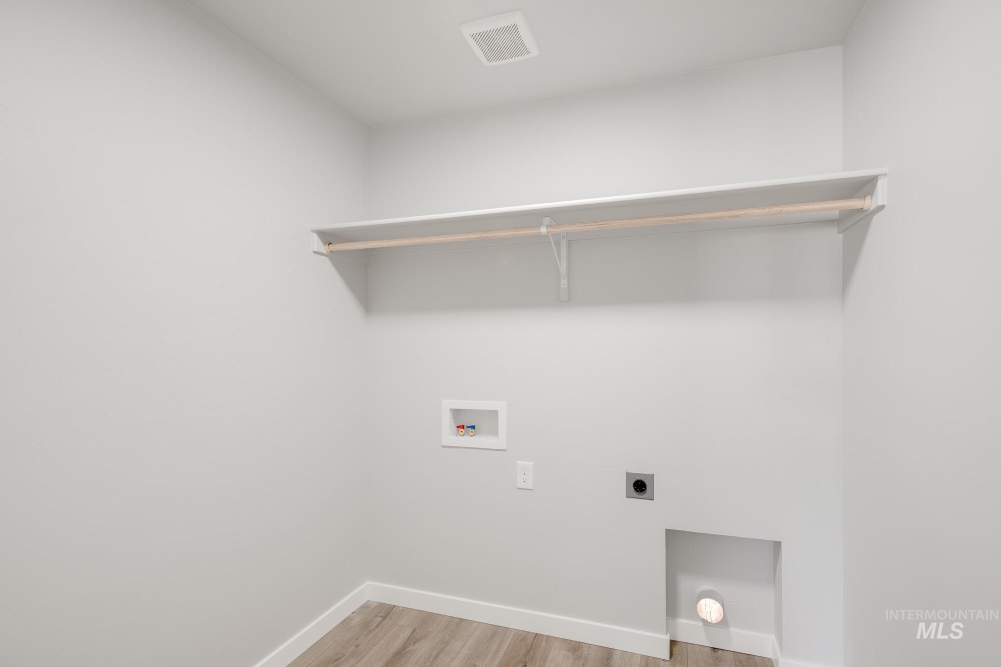 5328 Castleton Avenue Nampa, ID 83686 - Photo 21 of 26 Laundry area with hookup for a washing machine, light wood-style flooring, and hookup for an electric dryer