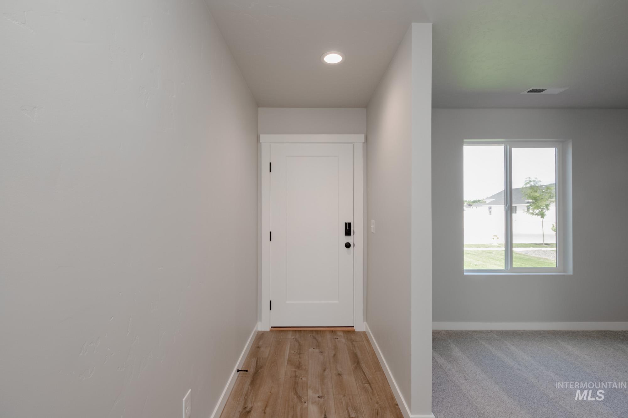 5328 Castleton Avenue Nampa, ID 83686 - Photo 3 of 26 Doorway to outside featuring recessed lighting and light wood-style flooring