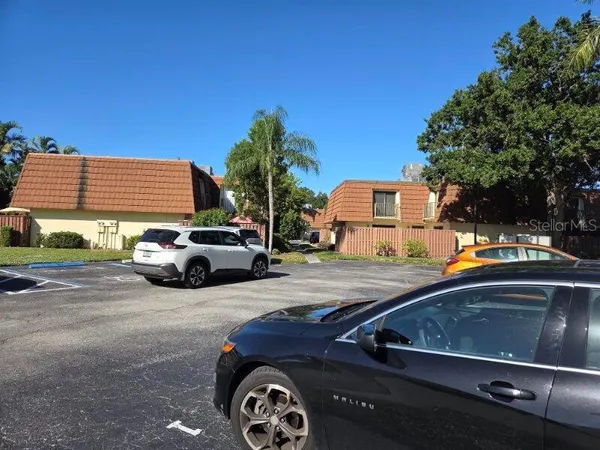 a view of street with parked cars
